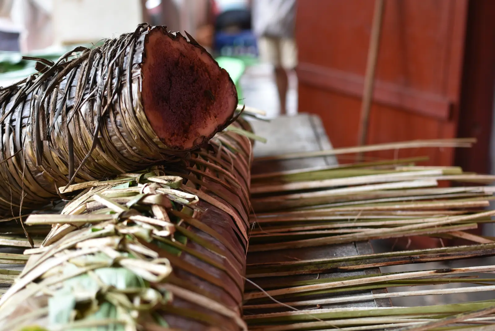 Slices of koba, a Malagasy rice and peanut cake, wrapped in leaves at Talata Volonondry