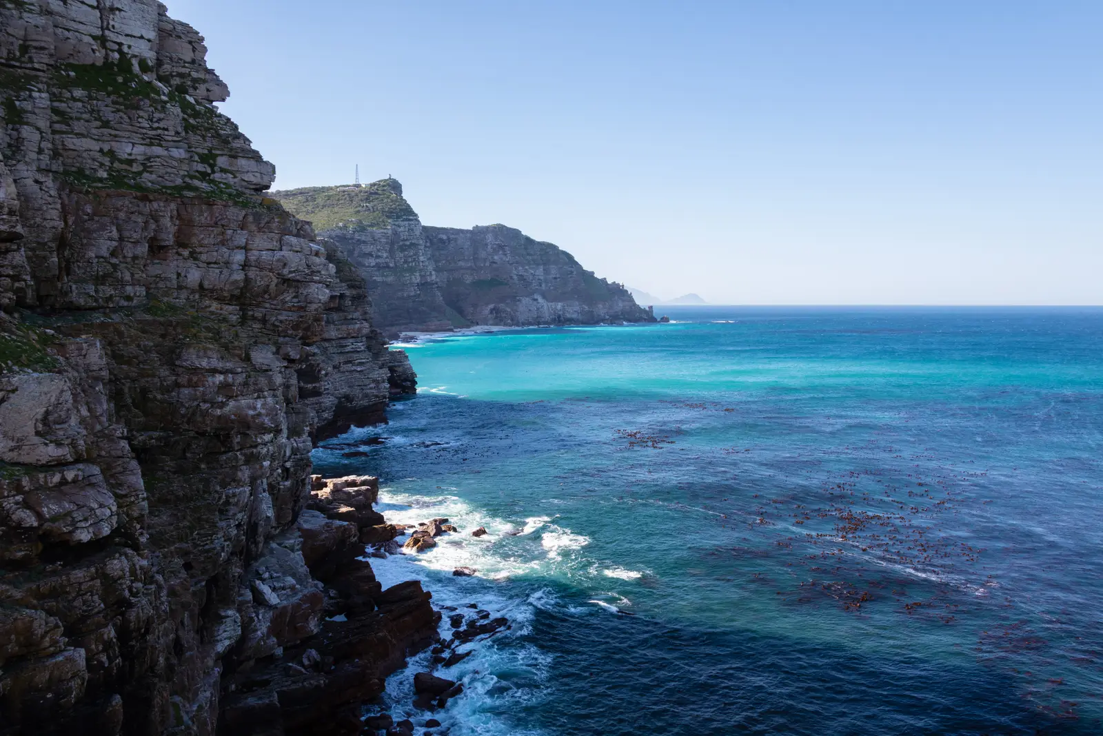 Layered cliffs at the Cape of Good Hope, looking along the coast towards the lighthouse on Cape Point