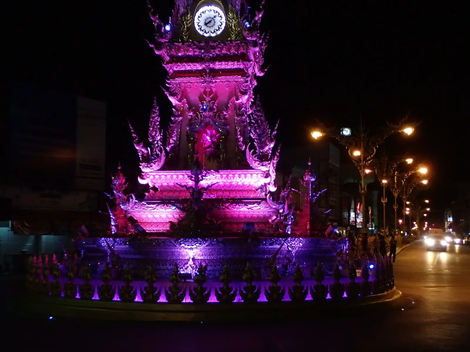 Chiang Rai's ornate clock tower lit purple at night