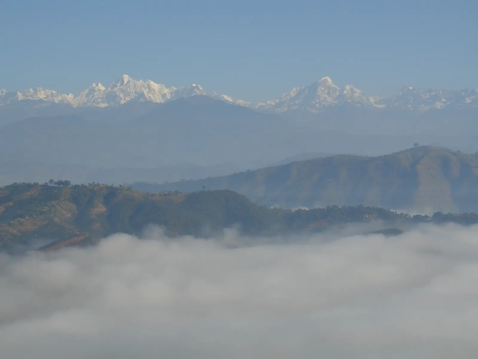 Snow peaks above a sea of cloud, seen from Dhulikhel