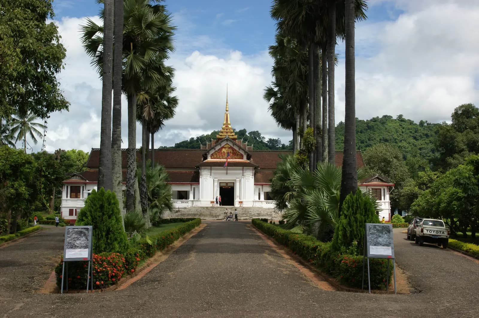 Palm-lined drive leading to the Haw Kham royal palace in Luang Prabang