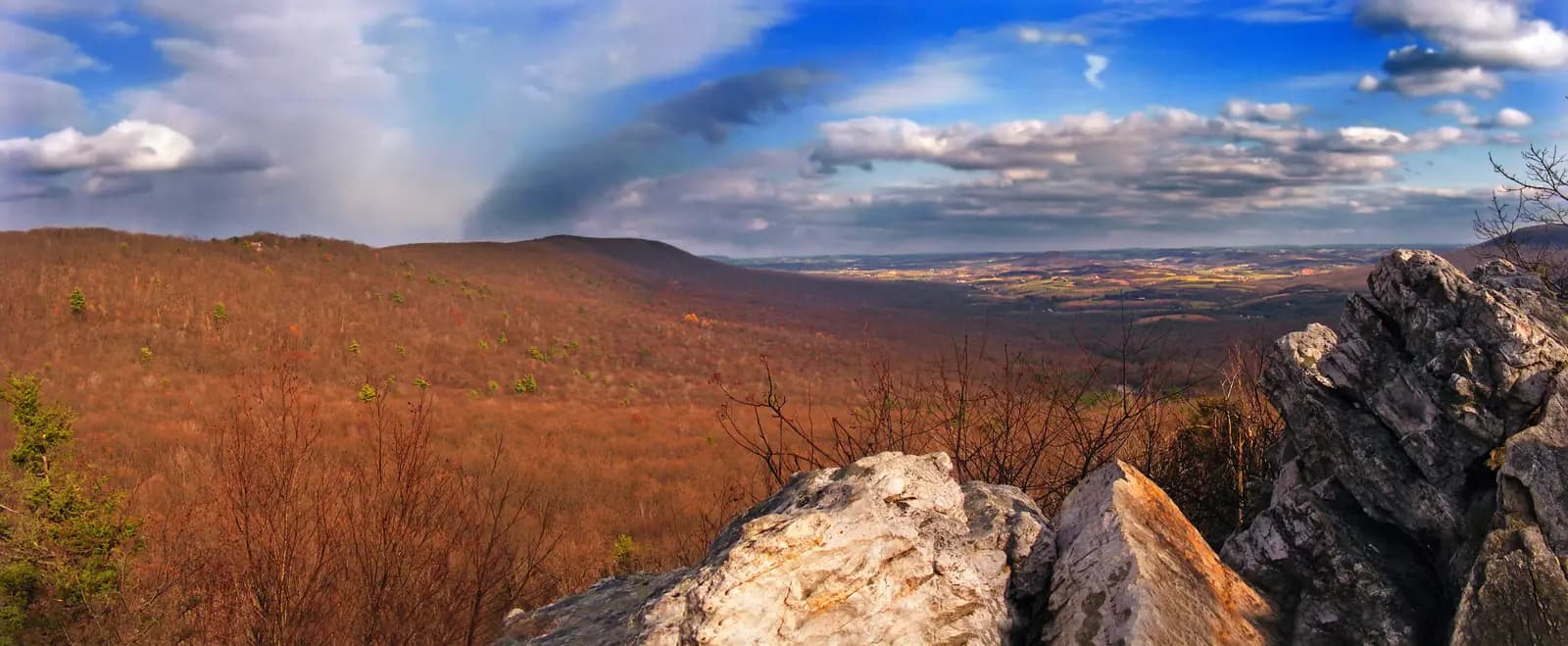 Autumn ridges and the farm valley below seen from a rocky lookout at Hawk Mountain Sanctuary