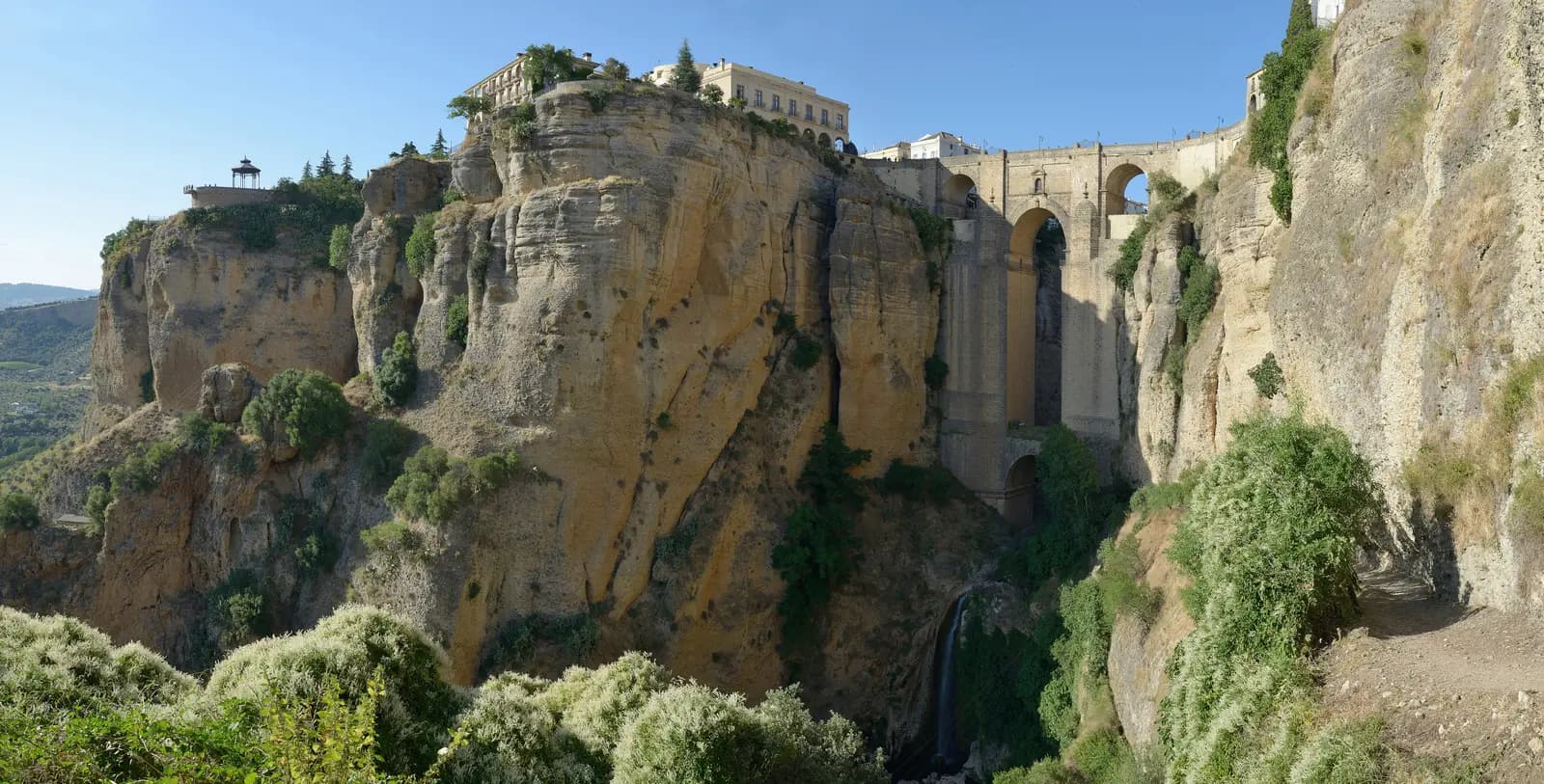 The Puente Nuevo bridging the sheer gorge of El Tajo in Ronda, with buildings along the clifftop