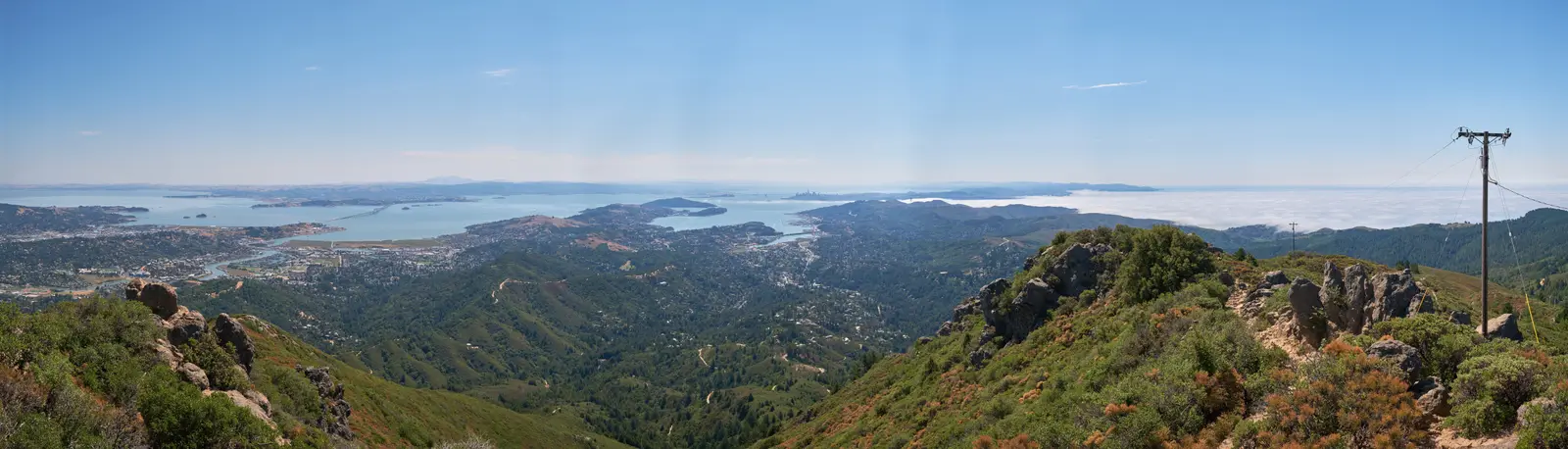 Looking south from East Peak over the ridges of Marin to Richardson Bay, Tiburon and the bay, with fog lying on the ocean