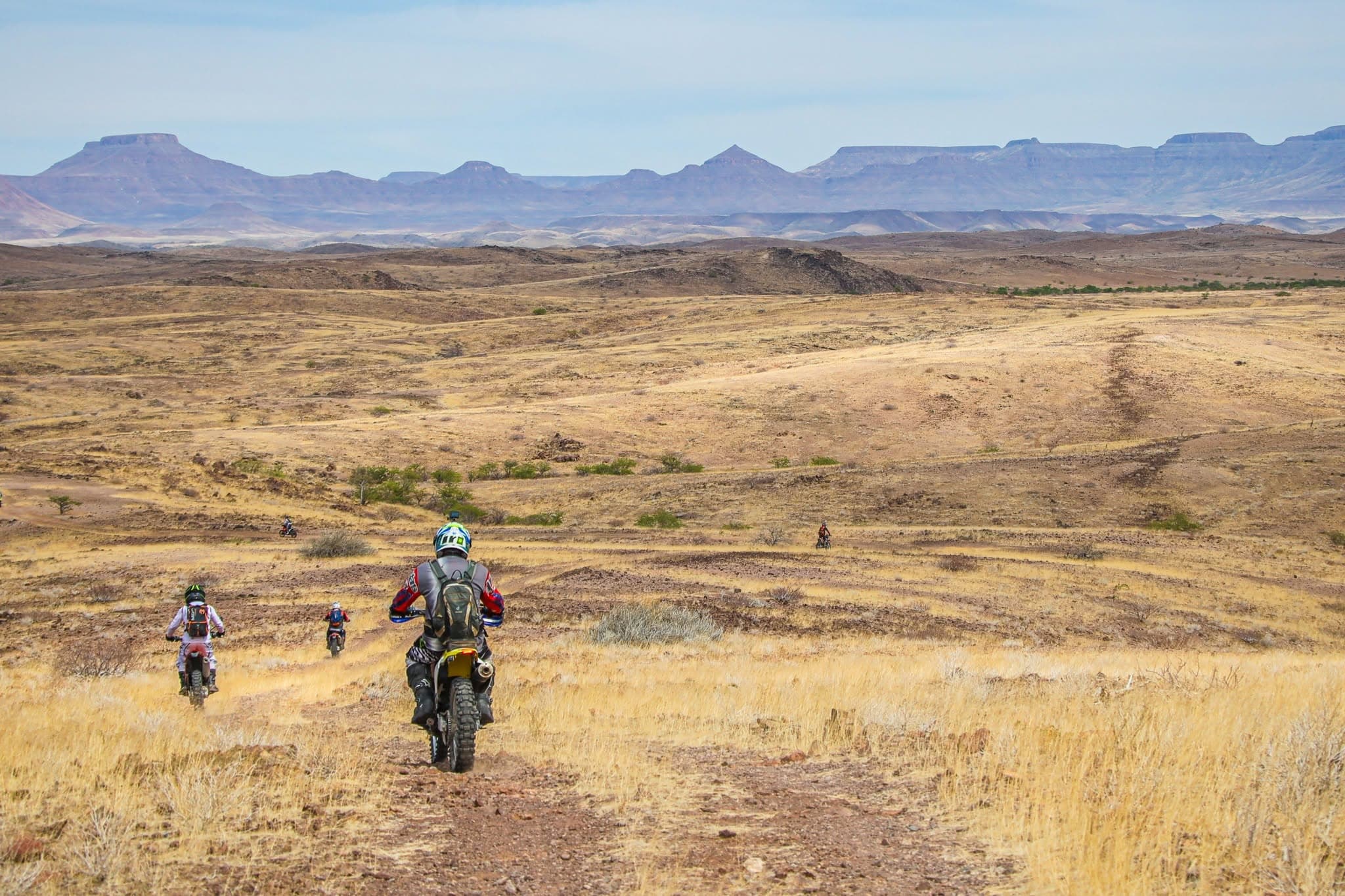 Motorcycle riders on a gravel road in Damaraland, Namibia